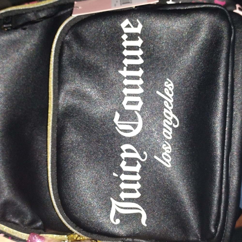 Womens black , white , pink & violet colored juicy couture designer backpack